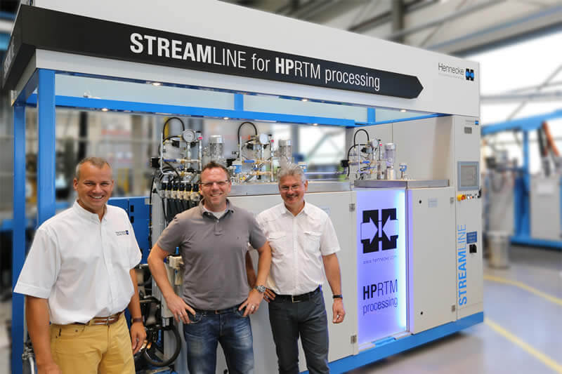 Cumulative know-how of fiber composite components production (from left to right): Jens Winiarz (Head of Sales Composites & Advanced Applications), Jens Geuer (Product Manager Lightweight Technologies), and Jürgen Wirth (Manager Application & Development Technology) in front of the new 3-Component STREAMLINE in the Hennecke TECHCENTER Cumulative know-how of fiber composite components production (from left to right): Jens Winiarz (Head of Sales Composites & Advanced Applications), Jens Geuer (Product Manager Lightweight Technologies), and Jürgen Wirth (Manager Application & Development Technology) in front of the new 3-Component STREAMLINE in the Hennecke TECHCENTER